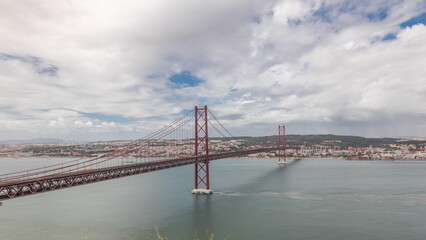Panorama showing Lisbon cityscape and Tagus river timelapse with 25 of April bridge