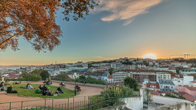 Panorama showing Jardim do Torel timelapse with views to the city center of Lisbon during sunset. Portugal