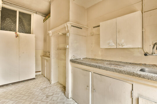 Old neglected kitchen interior with vintage appliances