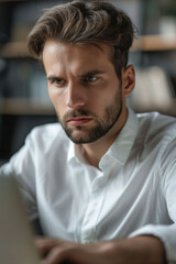 Obraz premium Focused business man typing at laptop in office closeup. Guy surfing internet