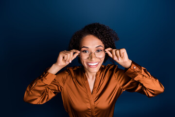 Top view photo of excited positive lady touch spectacles enjoy optics advert isolated over blue color background