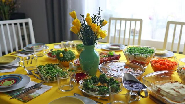 Traditional dishes from Poland for Easter breakfast, lying on the table in the dining room at home. High quality FullHD footage