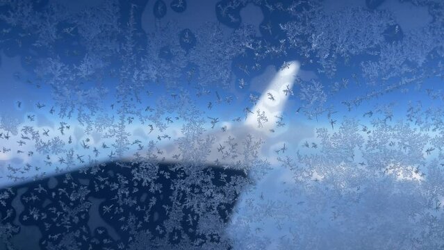 Ice flowers on airplane window, 4 k video