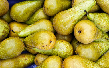 Pears in a market. Fresh and juicy pears background.