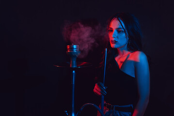 The theme of the hookah. A young girl gets the pleasure of Smoking hookah