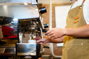 Barista making a coffee.