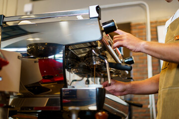 Barista making a coffee.