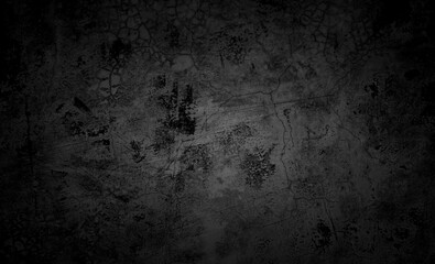 Black concrete wall background of a building with scratches and cracks. wall texture background