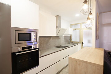 modern kitchen in a home equipped with appliances and decoration