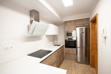 modern kitchen in a home equipped with appliances and decoration