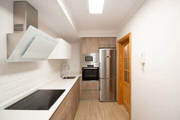 modern kitchen in a home equipped with appliances and decoration