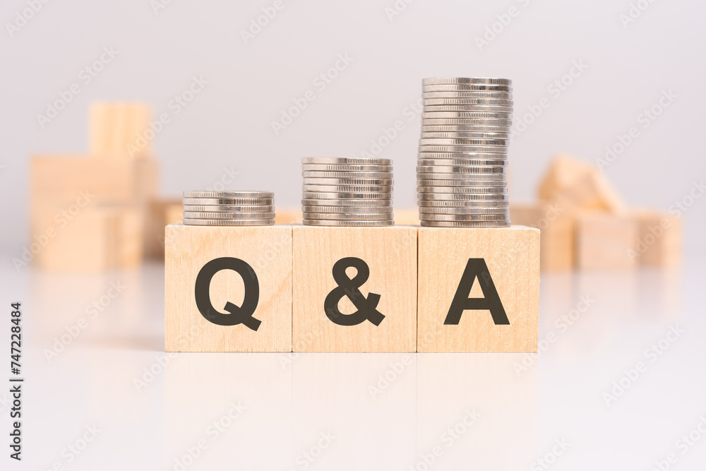 Poster q and a concept with cubes and coins on light background