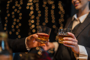 Barwoman pouring whiskey whiskey glass..