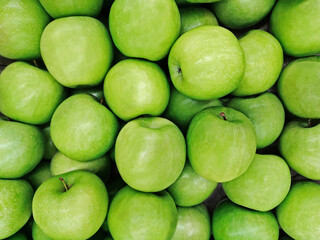 Green apples background. Top view or flat lay. Healthy natural food concept