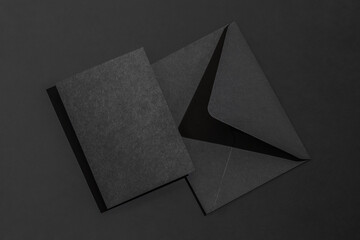A black envelope on a black background with a blank black letterhead.