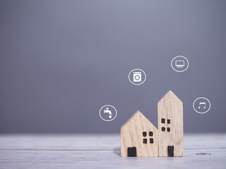 Miniature house with smart home icons. The concept of smart home control and automation system...