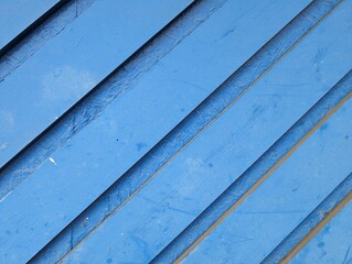 Obraz premium Blue painted wooden slats on an exterior wall