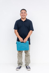 Full body photo of a smiling middle aged Asian man casually holding a blue toolbox, standing against an isolated white background.