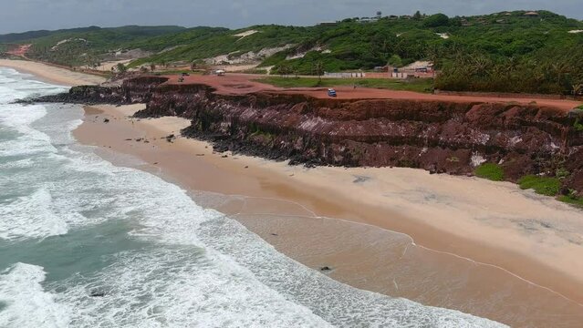 Pipa's beach became known as Itacoatiara, which means 'writing or drawing on stone' due to its colorful cliffs. (Praia da Pipa, Brazil).