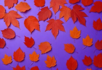 Fototapeta na wymiar Pattern of dry orange metallic leaves on violet background,Red autumn leaves on a purple background