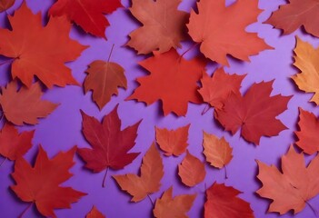 Naklejka na ściany i meble Pattern of dry orange metallic leaves on violet background,Red autumn leaves on a purple background
