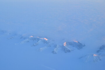 View of Greenland from Jet Plain Window in Winter Nature cold ice Mountains