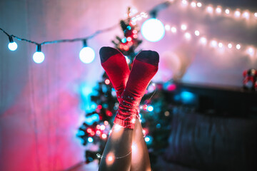 Woman's feet wearing red socks at Christmas