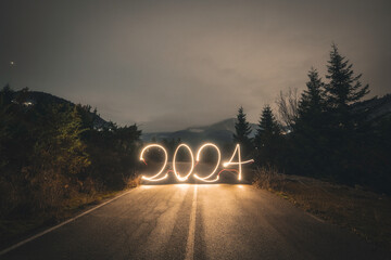 Year 2024 lightpaint on a mountain road 