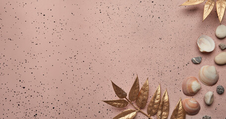 Elegant summer background with golden foliage and shells, copy space. Extra wide banner