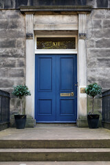 Old Georgian stone townhouse door with fanlight window above door