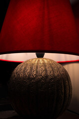Red lamp with warm light and floral trim