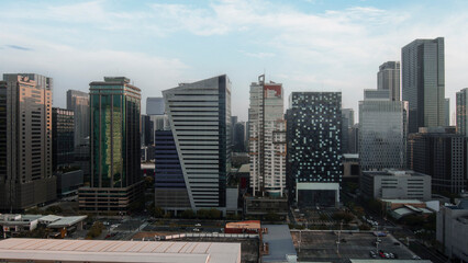 Urban landscape at dusk capturing the modern architecture of BGC, Metro Manila's bustling business...