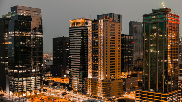 A high-angle view of BGC, Metro Manila's vibrant business district at twilight, showcasing modern architecture.