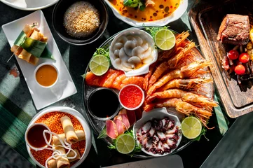 Foto op Plexiglas Set Seafood with salmon fish, tuna, shrimp, caviar on plate © pavel siamionov