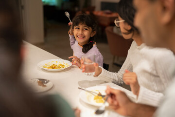 Family dining at home in evening