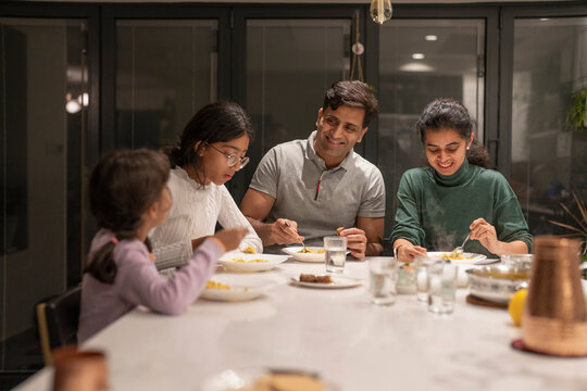 Family dining at home in evening