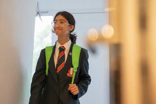 Schoolgirl at home after returning from school