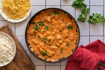 Chicken strogonoff accompanied with rice and potato straw.