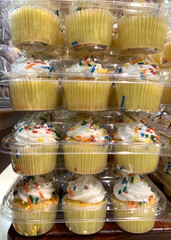 Vanilla cupcakes packaged in plastic for sale