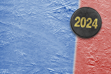 Hockey puck on blue and red ice