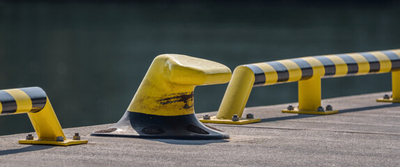 PORT QUAY - Yellow bollard for mooring ships