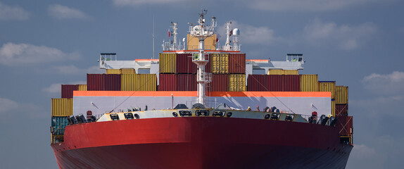 MARITIME TRANSPORT - A container ship maneuvers in port to the transhipment terminal
