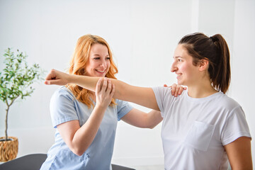 Modern rehabilitation physiotherapy at work with client