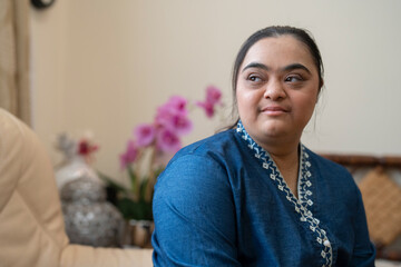Portrait of young woman with down syndrome at home © Cultura Creative