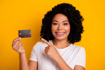 Photo of pleasant nice girlish woman with chevelure wear white t-shirt indicating at credit card...