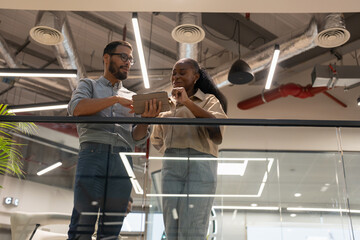 Office workers talking in corridor