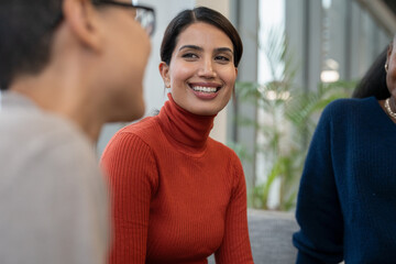 Coworkers having meeting in office lobby