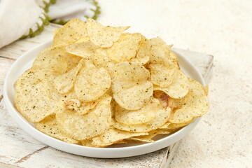 Potato Chips Served on a Plate on White Background