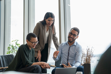 Business people having meeting in office lobby