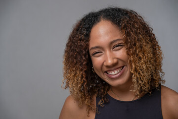 Portrait of smiling woman with curly hair